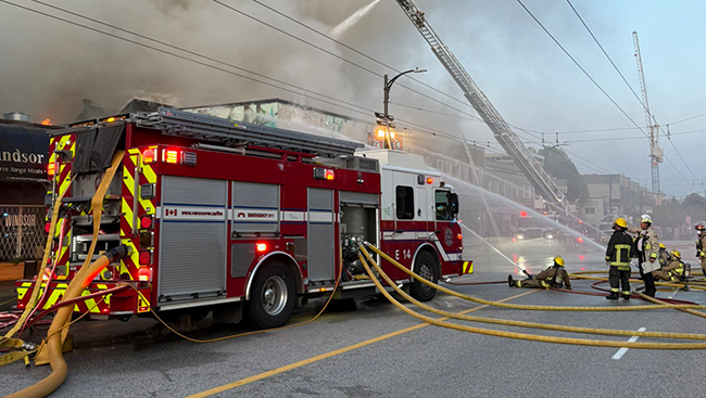 Crews fight fire in downtown Vancouver as smoke spreads across city